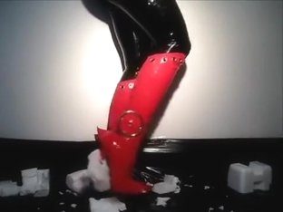 Tight_latex_and_fetish_boots_w_red_stiletto_heels_crushing_s