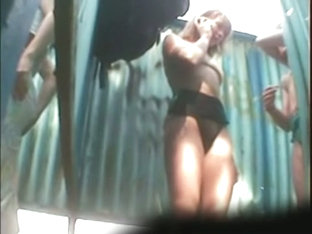 Real voyeur beach changing room video starring two girls demonstrating theit tits