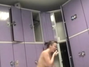 Naked female is sitting on the changing room bench