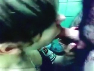 Brunette Gives Her BF A Blowjob On A Public Toilet