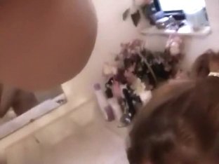 Tattooed blonde sucks cock in bathroom