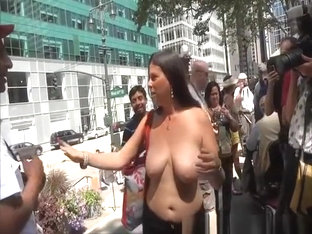 Topless women in street