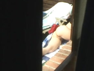 Guy Made A Window Peep Vid With A Chick Sunbathing