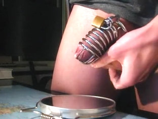 Juvenile fellow in chastity, sex-toy prostate milking, eats it all.