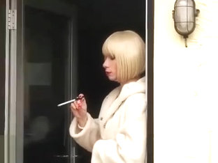 Naughty smoking blonde TGirl maid has tight pert ass spanked