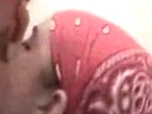 Busty wife with a red bandana demonstrating her oral skills