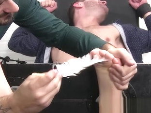 Bound and blindfolded hunk Sean Holmes endures feet tickling