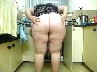 Obese Dark Brown Hair Whore Cleans The Kitchen On Web Camera