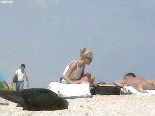 Sexy blondie relaxing on the nudist beach while I.m spying with my cam