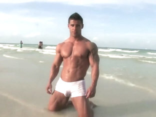 Handsome hot bodybuilder beach