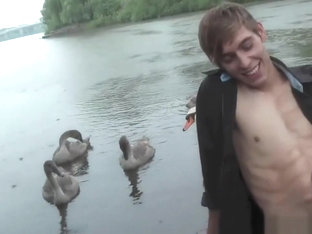 Biker pissing at river side