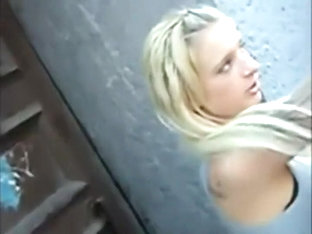 Blonde girl's boobs spied on a street