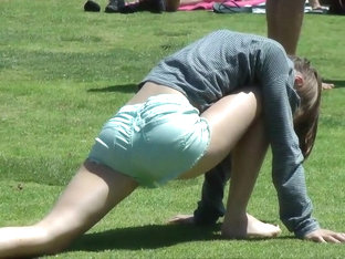 Beautiful girl does yoga in the park