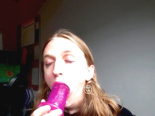 Tgirl slobbers on a dildo and fucks herself