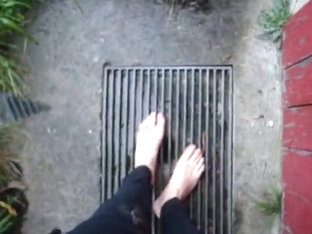 In long Zivalco Rubberboots and barefoot on Street and River