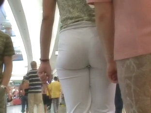 A fan of sexy ass voyeur films the hot butts in white pants