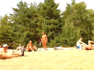 Wives And Their Husbands Sunbathing At The Nudist Beach