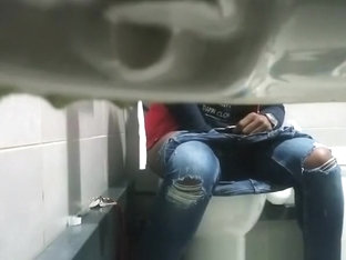 Concealed camera in public toilet catches ebony girl