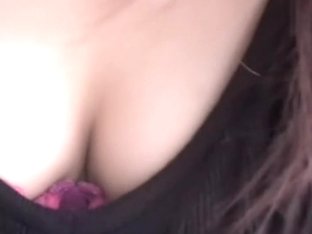 Friendly Asian Gal Keeps Smiling While Her Cleavage Is Totally Revealed