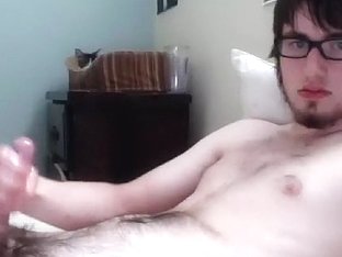 Nice-looking man is playing within doors and filming himself on camera