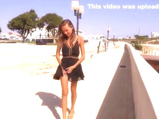 SuperBeauty in short black dress up dress in the streets