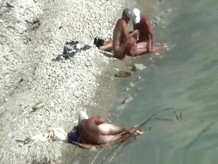 Two nudist couples spied at rocky beach