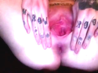 Closeup Of This Babe With Tats All Over Her Fingers Playing With Her Swollen Shaven Pussy.