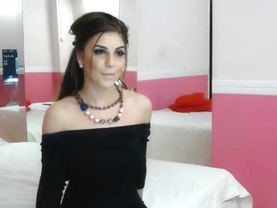 Beautiful babe JanettJones in a black dress