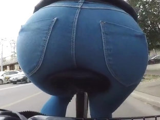 sexy round ass tight jeans bicycle in public city