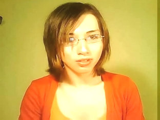 Lonely tranny in orange jerks for webcam