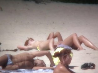 Lazy Chicks Lie On The Beach And Demonstrate Their Bodies