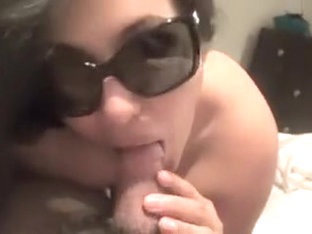 Busty Brunette Blows Dick With Sunglasses On