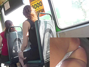 Beautiful brunette girl was waiting a bus and upskirted