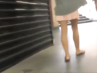 Voyeur peeps on appealing girl's skirt