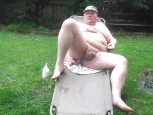 Fat man in the rain and mud