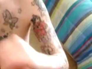 Tattooed Hottie On Her Knees Sucking Dick