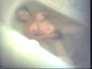 Hairy mom masturbating in bath tube.