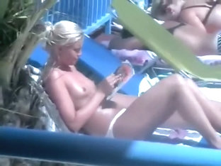 Topless Girl Reading By The Pool