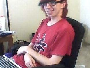 Charming fagot is playing in a small room and filming himself on computer webcam