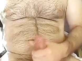 Attractive boy is masturbating in a small room and filming himself on camera