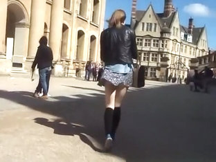 Wind lifts teen short skirt and exposes her ass