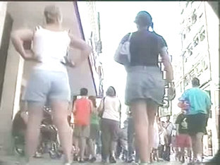 Summer girl with pony tails and jeans skirt voyeur video