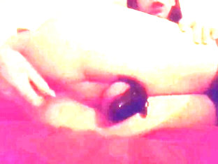 Sissy in chastity fucks herself with dildo