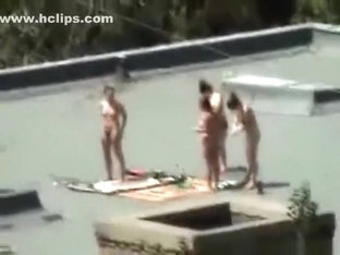 Voyeur Tapes 4 Girls Tanning With Their Boobs Naked On A Roof With His Cellphone