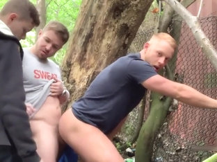 Two Brit guys have sex in woods. Third guy joins in