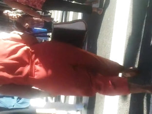 Older Lady With A Phatty In Orange Outfit.mp4