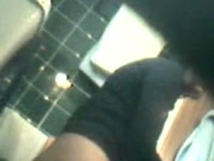 Amazing Chick Is Pissing In The Public Toilet On Voyeur Cam