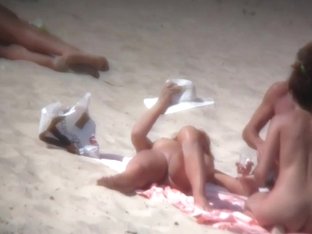 Stunning Women Relaxing Naked On A Sunny Beach