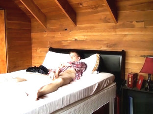 Hung twink Benji Elliott strokes cock in bedroom