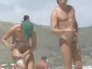 Naked babes caught on the voyeur camera relaxing on the beach